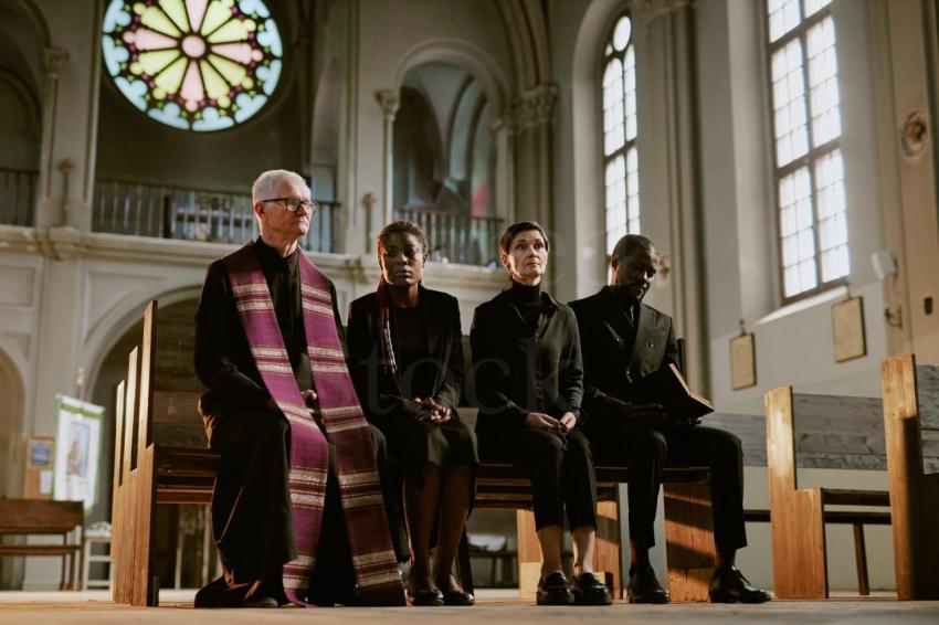 Pastor and Sorrowful Parishioners in Church