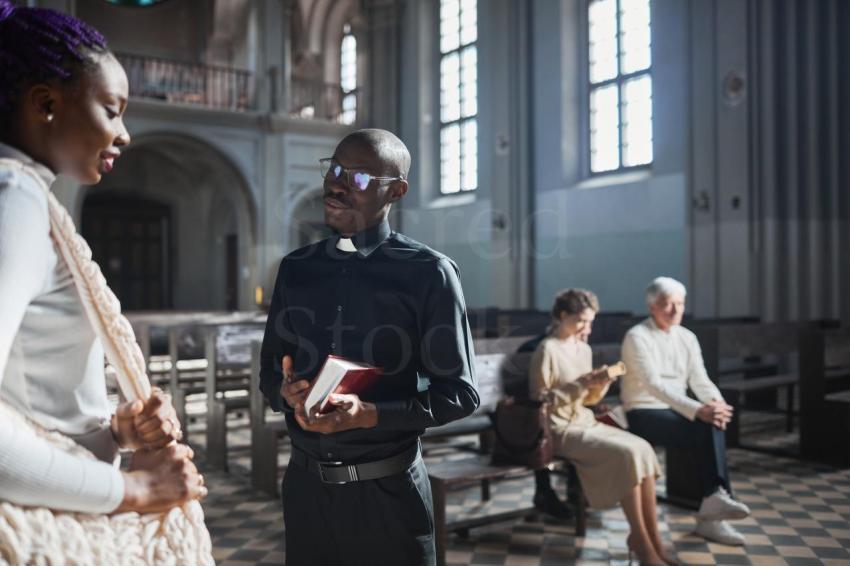 Priest talking to the faithful people